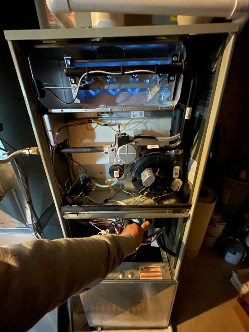 Inside a furnace cabinet during a no-heat repair